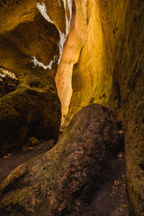 Beautiful curved crevice in canyon in sunny weather. Wide angle view of amazing sandstone formations in Karadakh gorge in mountains of Dagestan