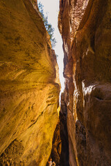 Beautiful curved crevice in canyon in sunny weather. Wide angle view of amazing sandstone formations in Karadakh gorge in mountains of Dagestan