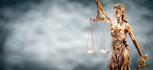Legal and law background concept statue of Lady Justice with scales of justice