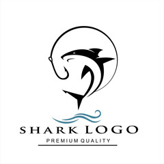shark logo with hook and sea