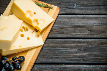 Fresh cheese with grapes and rosemary.
