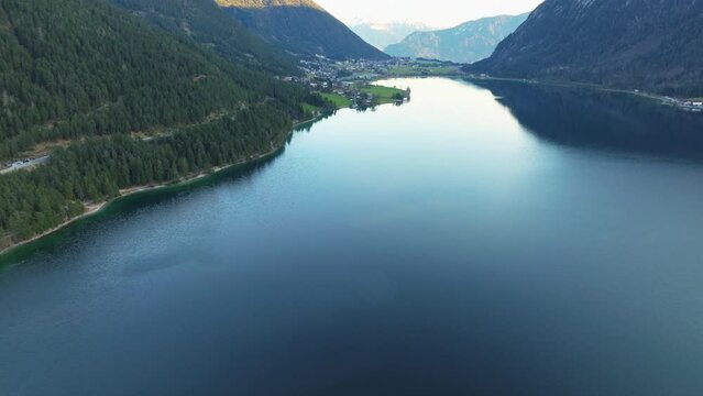 Blue And Calm Waters Of Lake Achensee In Tyrol, Austria - aerial drone shot
