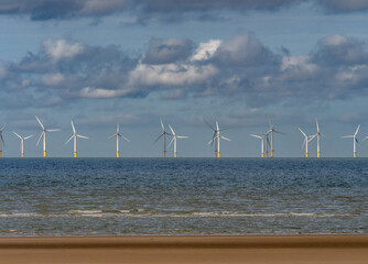 Wind Farm and Sand Patterns on a Welsh Beach, Rhyl, Wales, UK