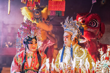 Chinese opera actor Light candle pray to god for prosperity on the occasion of the Chinese New Year