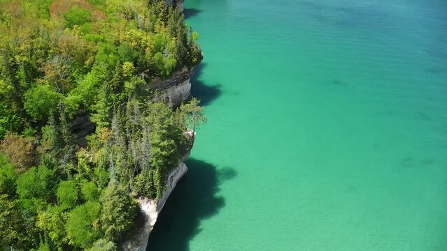 Aerial Pan Up of Lakeshore Rock Cliffs - Pictured Rocks National Lakeshore, Michigan