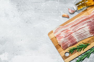 Raw bacon with herbs and spices.