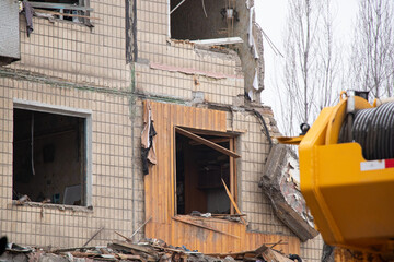 Obraz na płótnie Canvas A house blown up by a Russian rocket in the city of Dnipro on Pobeda Street in Ukraine, War in Ukraine, a rocket attack on civilians in their homes 2023