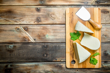 Soft cheese with mint leaves.