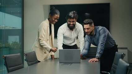 Success business team multiracial diverse people office workers group with laptop win celebrate corporate successful deal growth winning victory great teamwork good result put stacking hands together