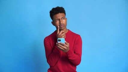 Serious black man using smartphone