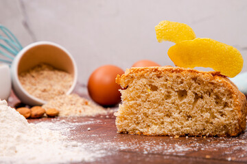 Yogurt cake accompanied by the necessary ingredients, cooking at home