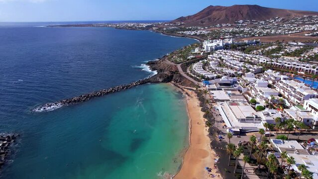 Lanzarote island, popular beach Flamingo in Playa Blanca resort. aerial drone video. Canary islands of Spain