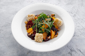 Salad with beets, cheese, oranges and nuts