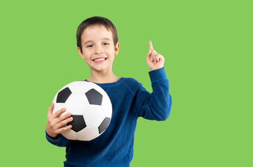 Child holding soccer football ball over isolated white background surprised with an idea or...