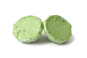 Marshmallows on white. Green split marshmallows on a white background. Two halves of marshmallows