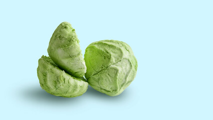 Marshmallow isolated on a blue background. Whole and split green marshmallows on blue