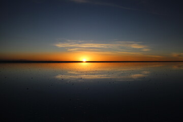 Fototapeta na wymiar Sunset over Uyuni salt lake in Bolivia