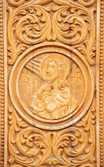 Fototapeta na wymiar A close-up of a wood engraving representing the face of Jesus Christ at the Dumbrava monastery - Romania