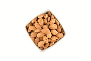 Almond in bowl isolated on white background with clipping path