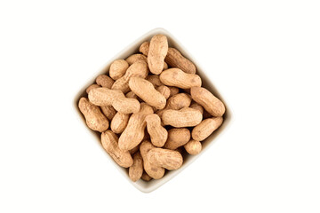 Roasted peanut in bowl isolated on white background with clipping path