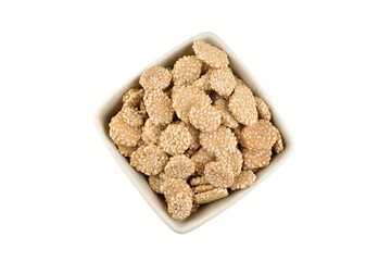 Indian winter snack revari in bowl isolated on white background with clipping path
