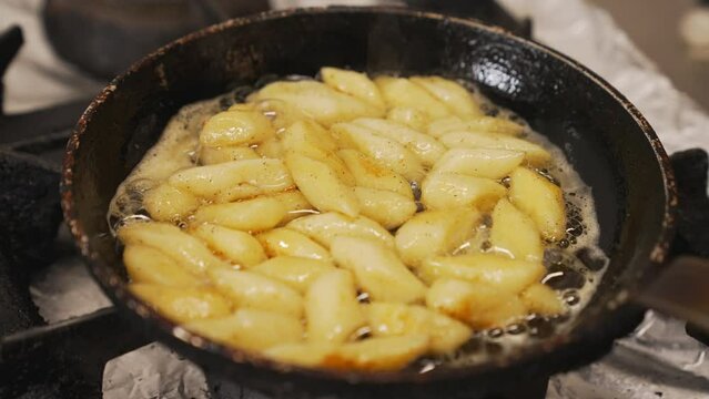 Potato dumplings - kopytka - in frying pan. Traditional Polish cuisine concept. Restaurant gas stove. High quality 4k footage