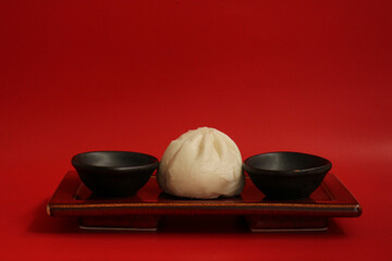 Close up Chinese Steamed Bun on red Background