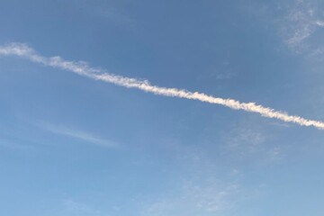 Contrails background, line-shaped clouds after the plane flies