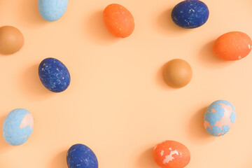 Copy space Easter colored eggs on a beige background. Frame. mock-up