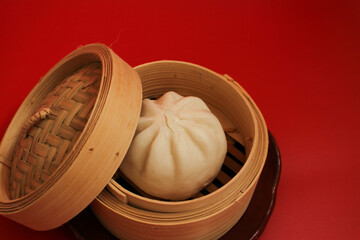 Close up Chinese Steamed Bun on red Background