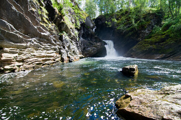 Waterfall in Hornindal, Norway, summer sunshine.