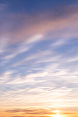 Naklejka na ściany i meble Sunset sky with light white clouds