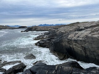 Amazing rocky ocean bay, rocky coast, huge stones, seascape, cloudy sky, Nordic seascape