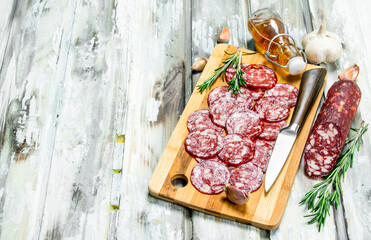 Sliced smoked salami with garlic and herbs.