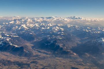 Obraz premium Aerial view of morning sunlight on Summer Alps. 