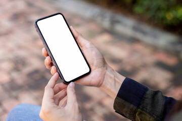 cell phone blank white screen mockup.hand holding texting using mobile on desk at office.background empty space for advertise.work people contact marketing business,technology
