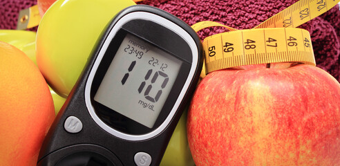 Glucometer for checking sugar level, fresh fruits and dumbbells using in fitness. Healthy nutrition...