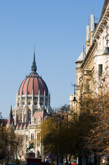 Obraz premium The Parliament Building. Budapest, Hungary with trees and street details.