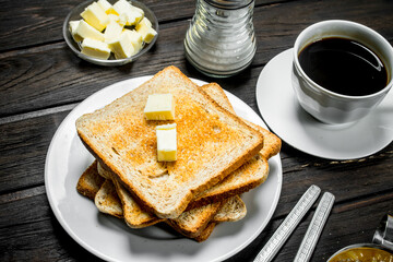 Breakfast. Toasted bread with butter and aromatic coffee.