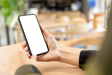 cell phone blank white screen mockup.hand holding texting using mobile on desk at office.background empty space for advertise.work people contact marketing business,technology