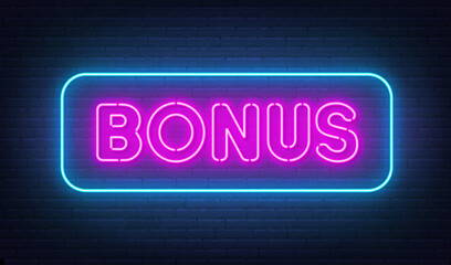 Bonus neon sign on brick wall background.
