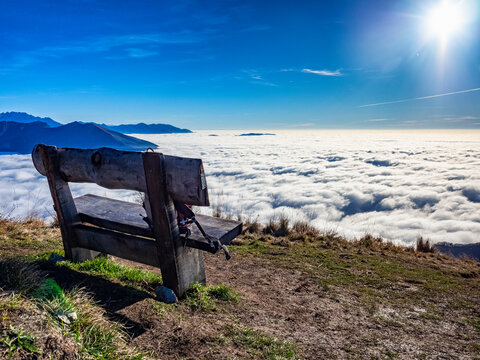 Bench over the clouds in the alps