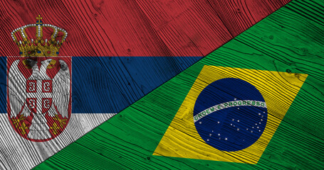 Background with flag of Serbia and Brazil on wooden divided table. 3d illustration