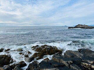 Amazing rocky ocean bay, rocky coast, huge stones, seascape, cloudy sky, Nordic seascape