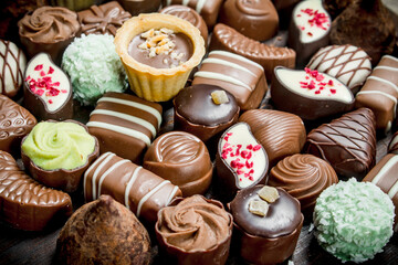 Chocolate candies with nuts and various fillings.