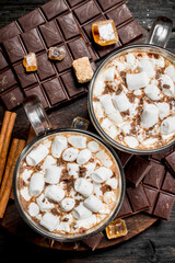 ot chocolate in a cups with marshmallows.