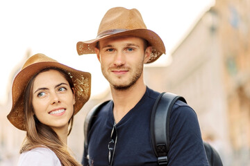 Happy Portrait of a happy young couple. A couple in love smiles and dreams. Valentine's Day. cheerful young couple in casual clothes traveling the world. romance and adventure. Tourists in love