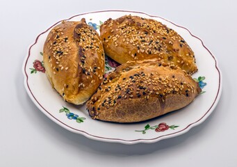 Meat pies topped with sesame seeds
