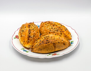 Meat pies topped with sesame seeds--
