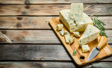 Blue cheese with branches of fragrant rosemary.